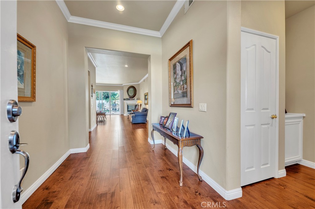 37678 Newcastle Road Murrieta, CA 92563 - Photo 12 of 44 a view of a hallway view with wooden floor and furniture