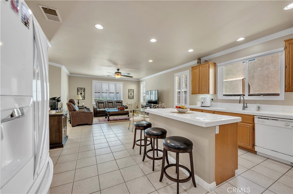 37678 Newcastle Road Murrieta, CA 92563 - Photo 16 of 44 a kitchen with lots of counter top space and appliances