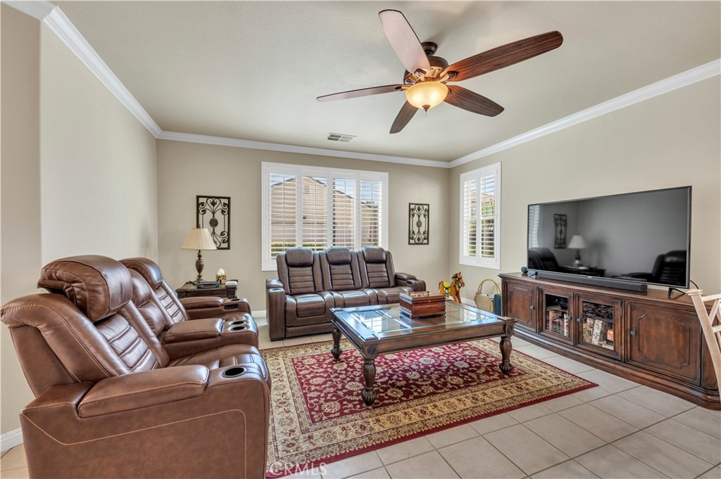 37678 Newcastle Road Murrieta, CA 92563 - Photo 20 of 44 a living room with furniture ceiling fan and a rug