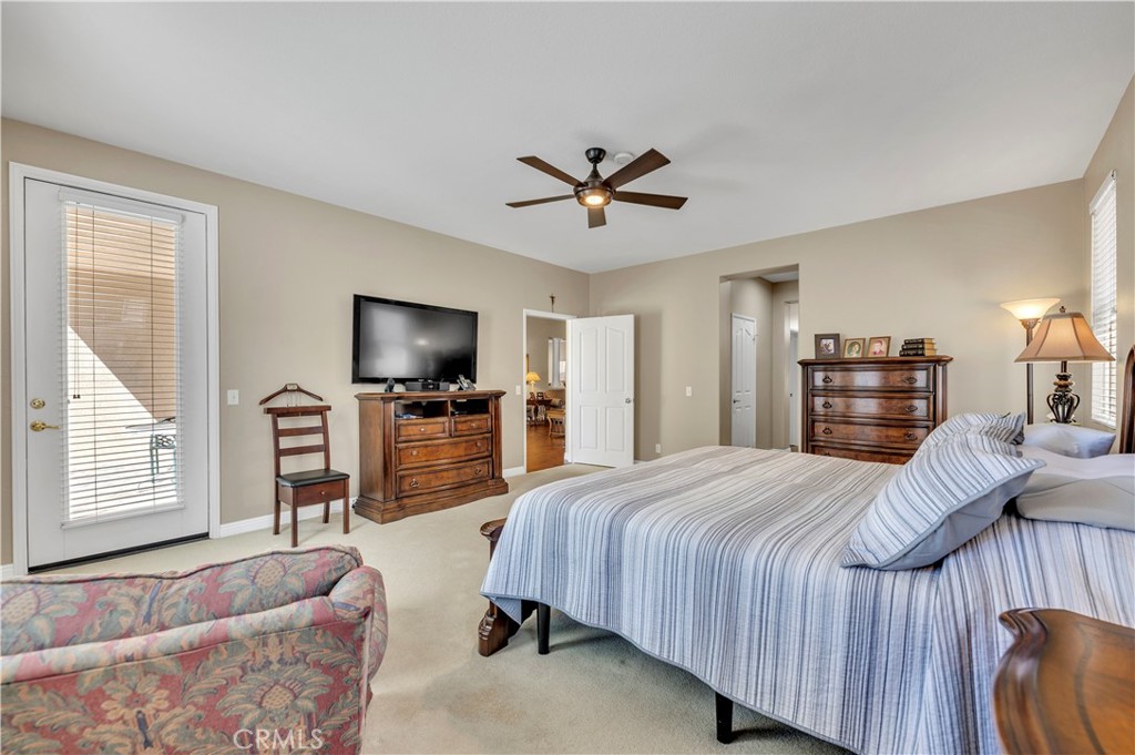 37678 Newcastle Road Murrieta, CA 92563 - Photo 21 of 44 a bedroom with a bed and a flat screen tv