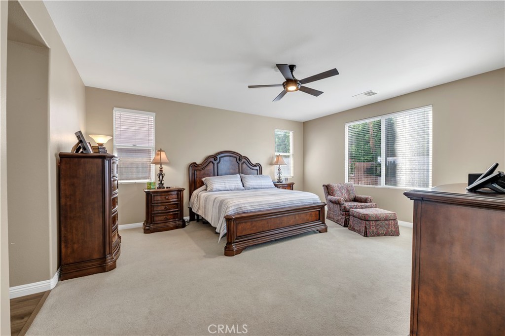 37678 Newcastle Road Murrieta, CA 92563 - Photo 22 of 44 a bedroom with a bed couch and window