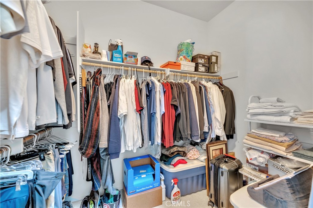 37678 Newcastle Road Murrieta, CA 92563 - Photo 24 of 44 a view of walk in closet with clothes and shoes