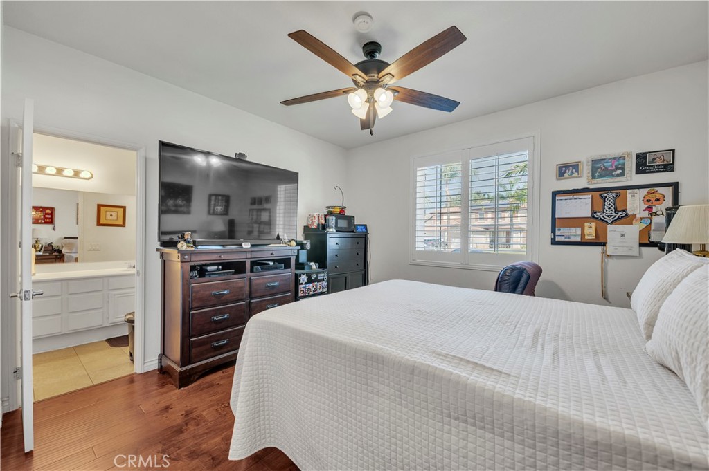 37678 Newcastle Road Murrieta, CA 92563 - Photo 27 of 44 a bedroom with a bed and dresser with mirror
