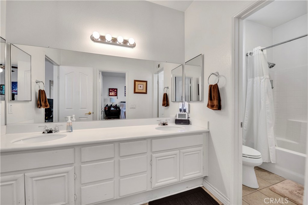 37678 Newcastle Road Murrieta, CA 92563 - Photo 28 of 44 a bathroom with a sink a toilet and shower