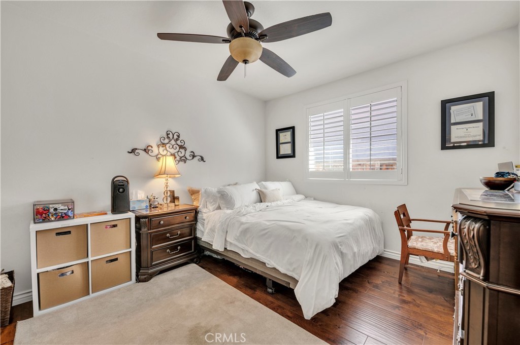 37678 Newcastle Road Murrieta, CA 92563 - Photo 31 of 44 a bedroom with a bed and a table in it