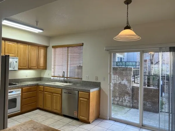 a kitchen with a sink stove and cabinets
