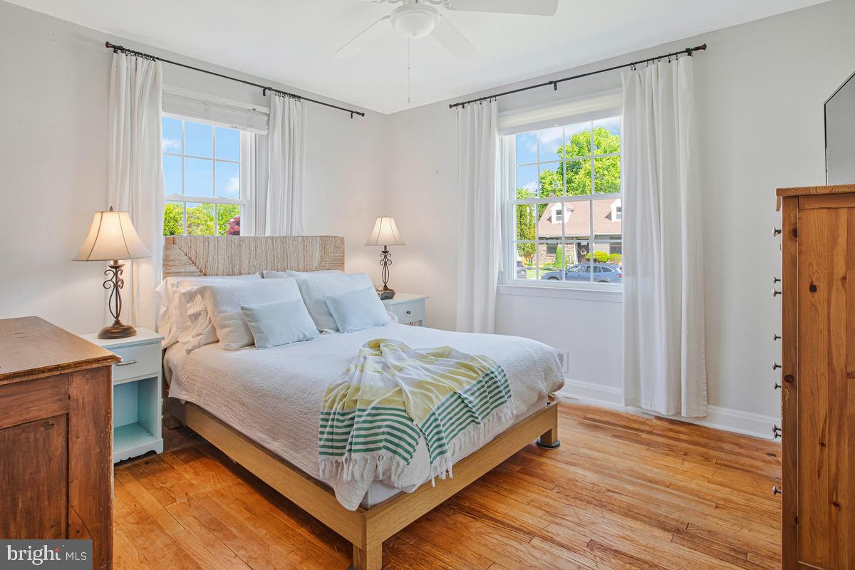 601 Forest View Road Linthicum Heights, MD 21090 - Photo 20 of 37 a bedroom with a bed and a chandelier