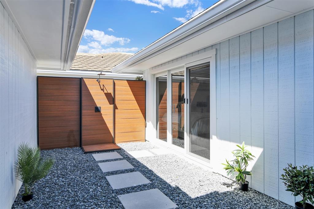 17026 Bay Street Jupiter, FL 33477 - Photo 19 of 77 a view of a entryway door of the house