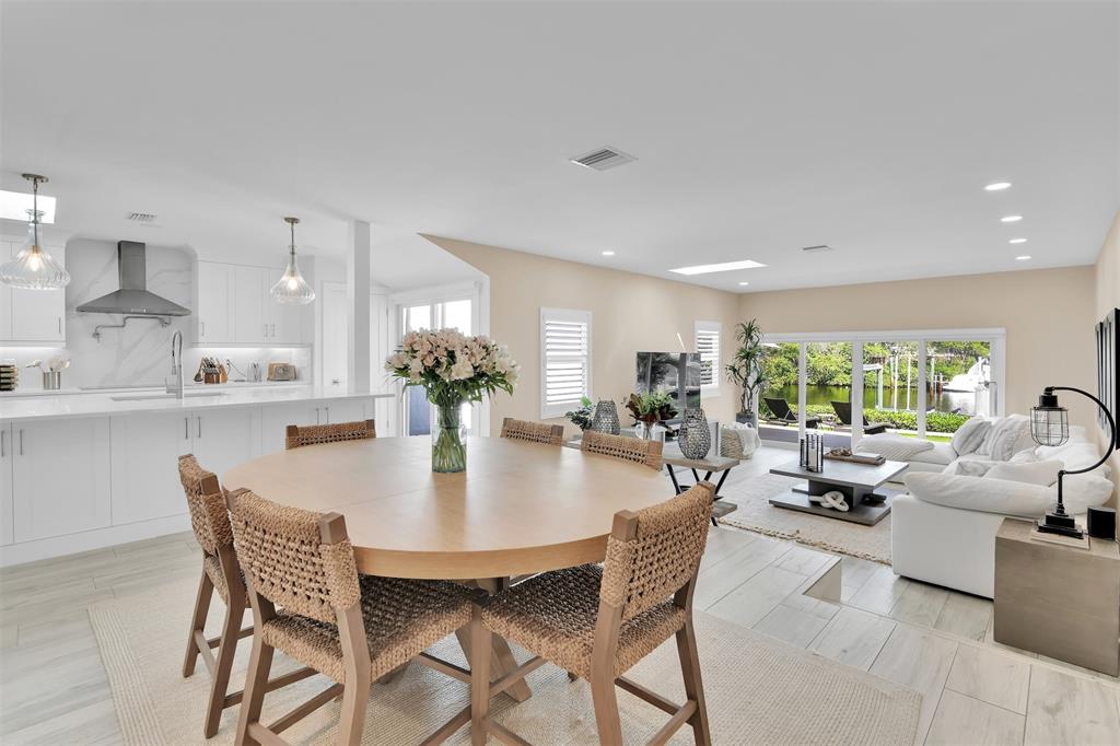 17026 Bay Street Jupiter, FL 33477 - Photo 23 of 77 a view of a dining room with furniture window and outside view