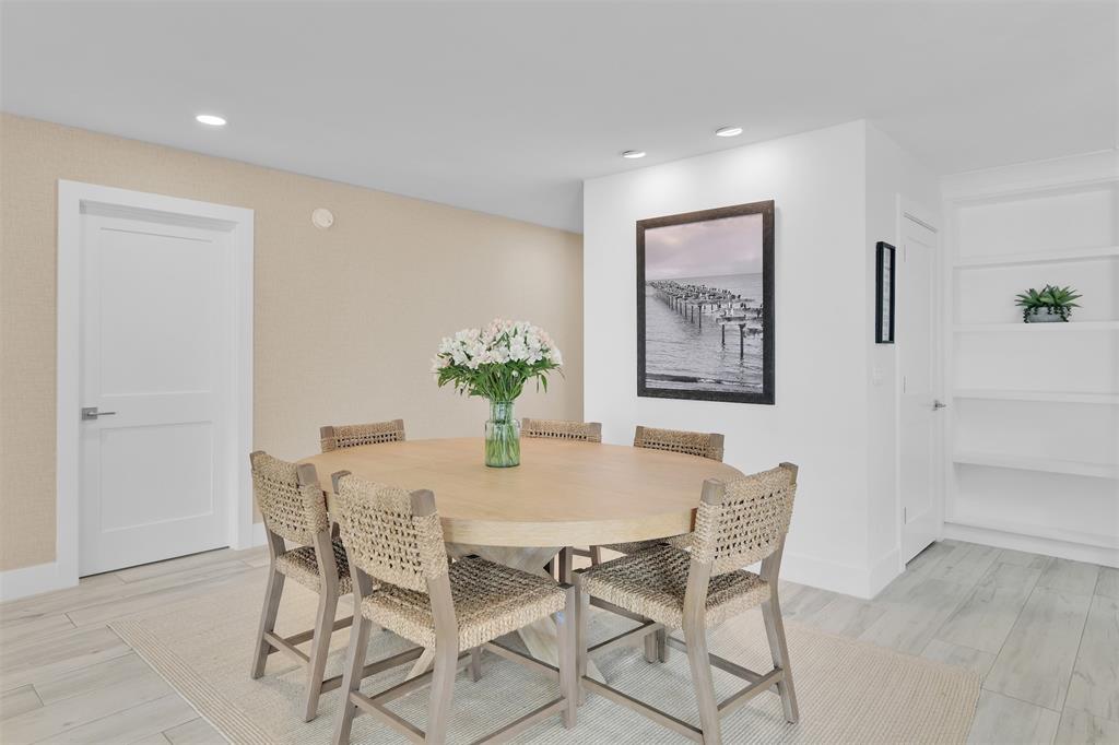 17026 Bay Street Jupiter, FL 33477 - Photo 26 of 77 a view of a dining room with furniture and wooden floor