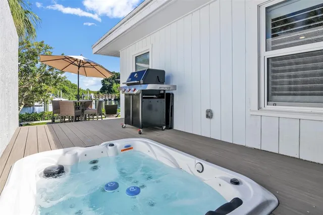 a lake view with boat and palm trees