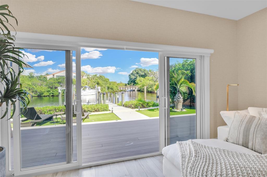 17026 Bay Street Jupiter, FL 33477 - Photo 39 of 77 a room with a bed and a large window