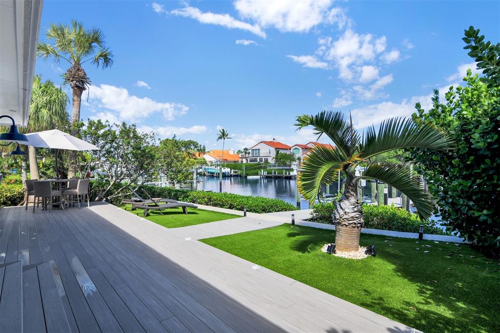 17026 Bay Street Jupiter, FL 33477 - Photo 42 of 77 a view of a fountain in front of a house with a fountain