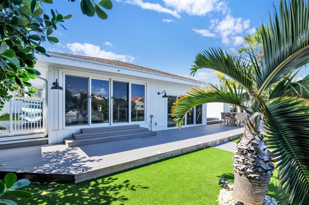 17026 Bay Street Jupiter, FL 33477 - Photo 44 of 77 a front view of a house with a yard