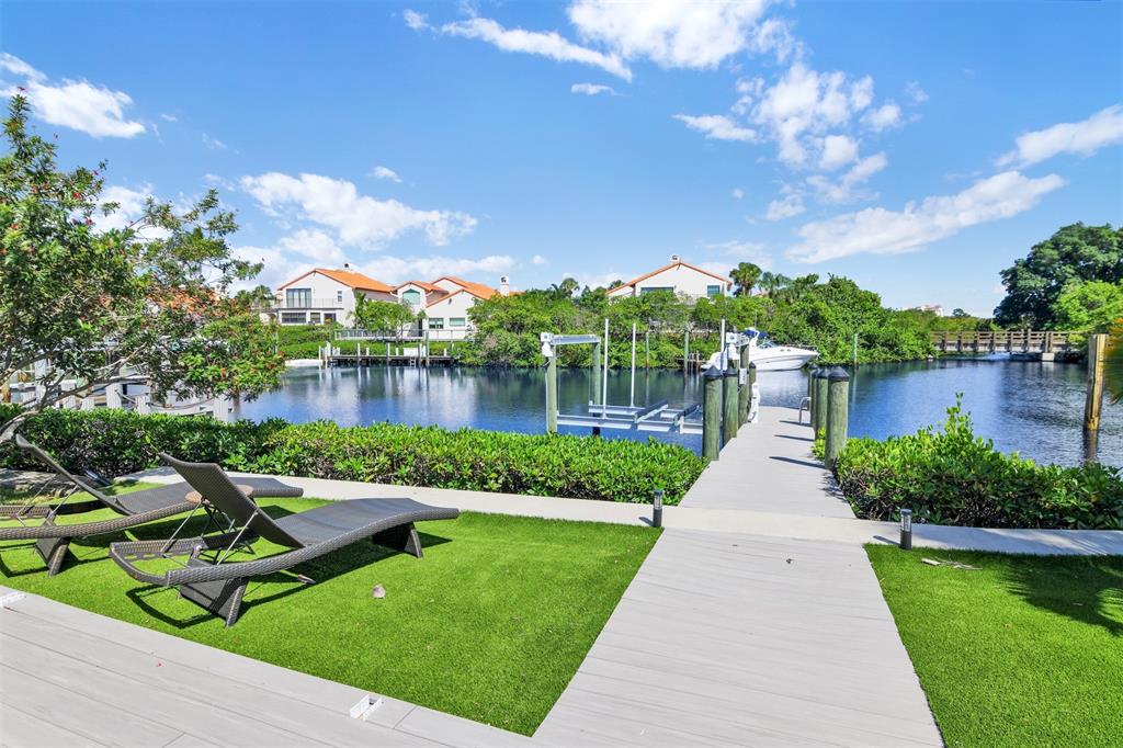 17026 Bay Street Jupiter, FL 33477 - Photo 48 of 77 a view of a garden with sitting area