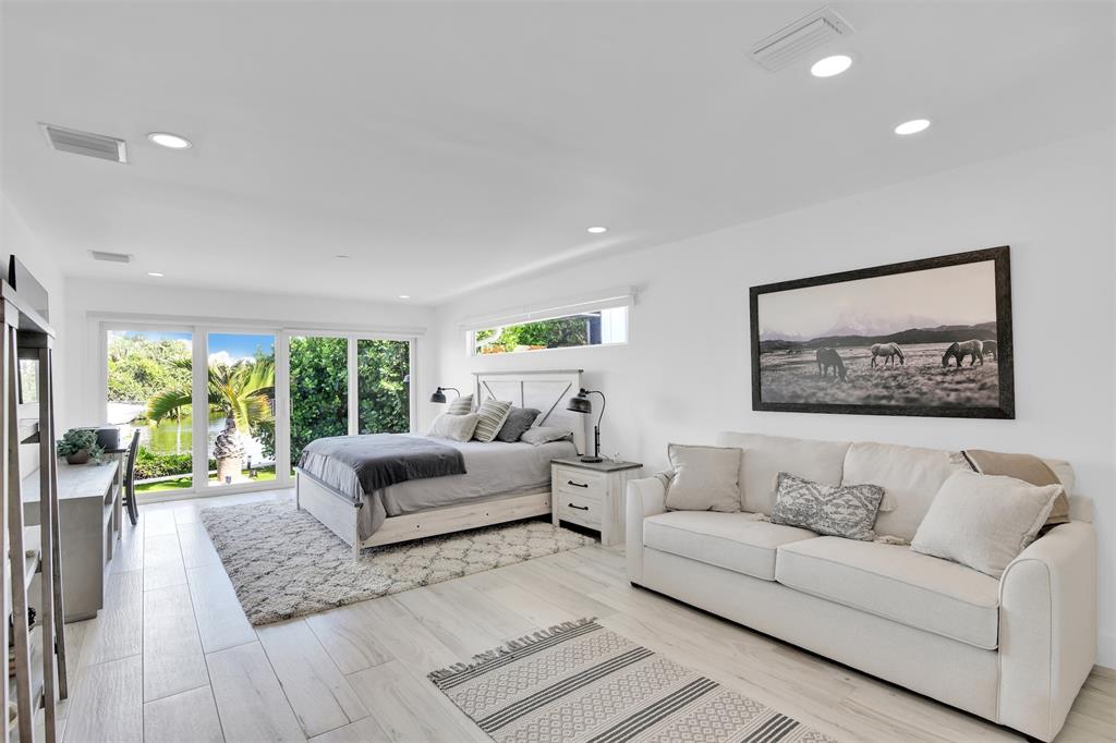 17026 Bay Street Jupiter, FL 33477 - Photo 55 of 77 a living room with furniture and a large window