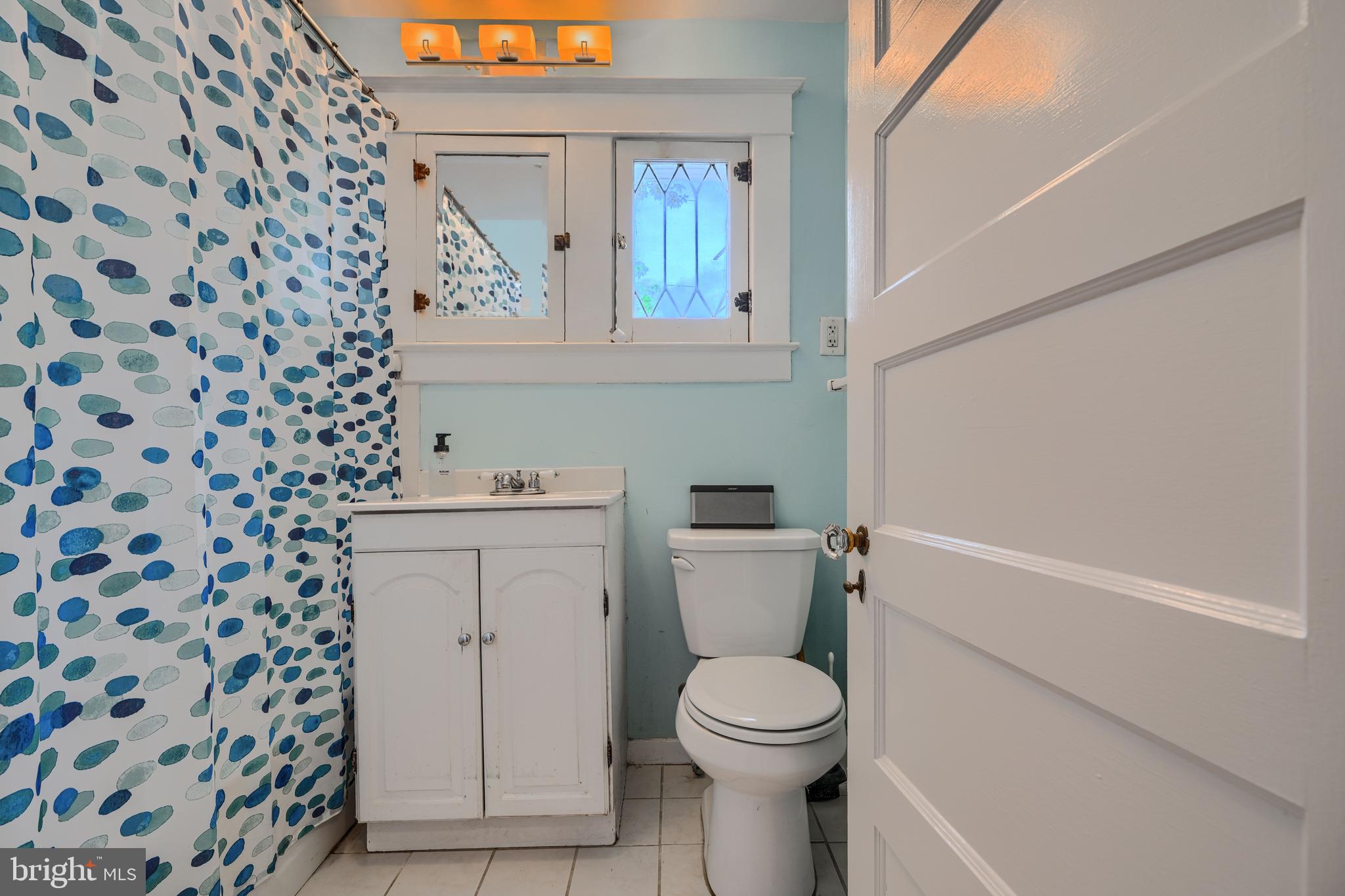 614 Hollen Road Baltimore, MD 21212 - Photo 24 of 42 a white toilet sitting next to a shower curtain