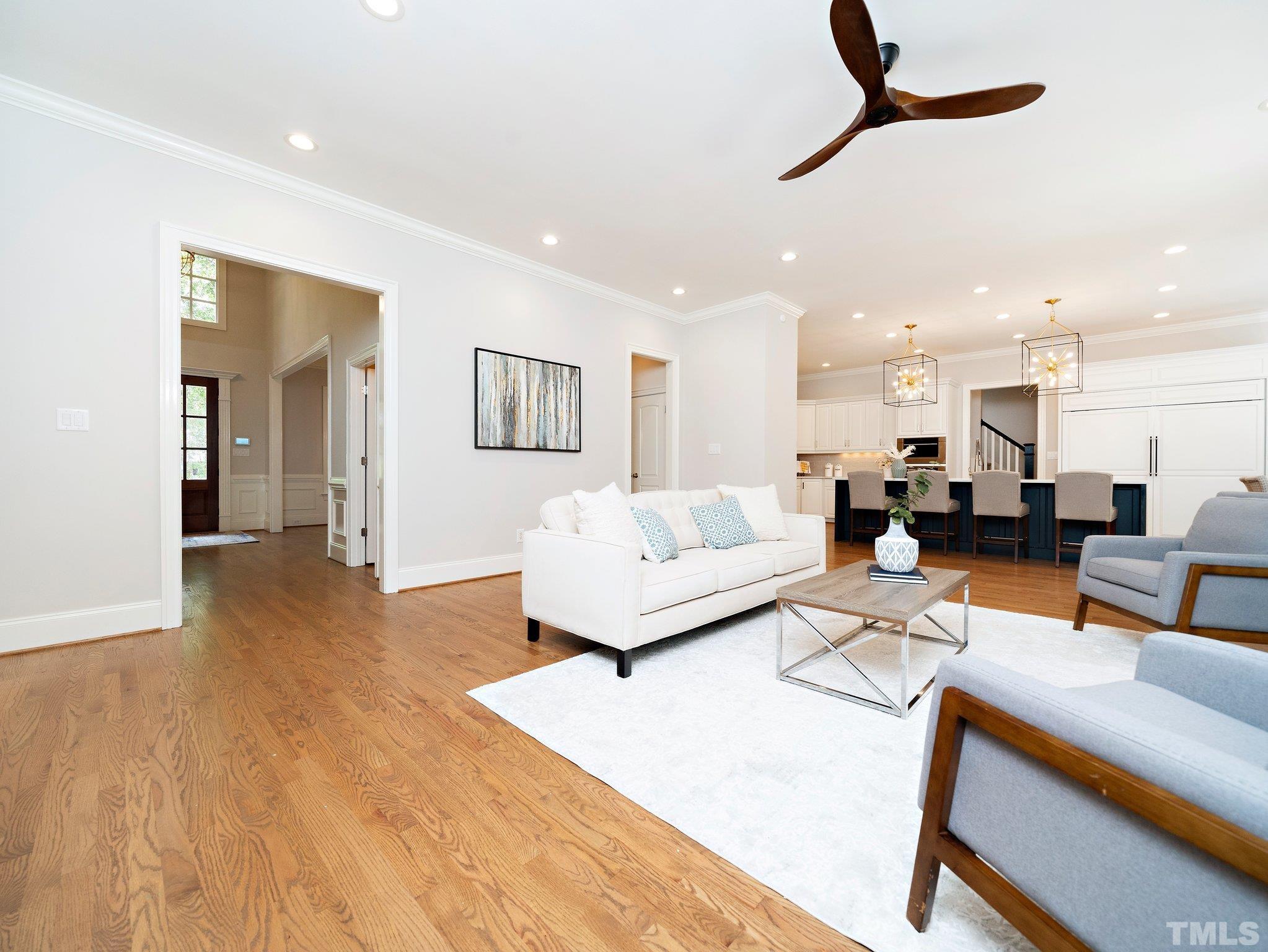 8104 Harps Mill Road Raleigh, NC 27615 - Photo 12 of 57 a living room with furniture and a view of kitchen