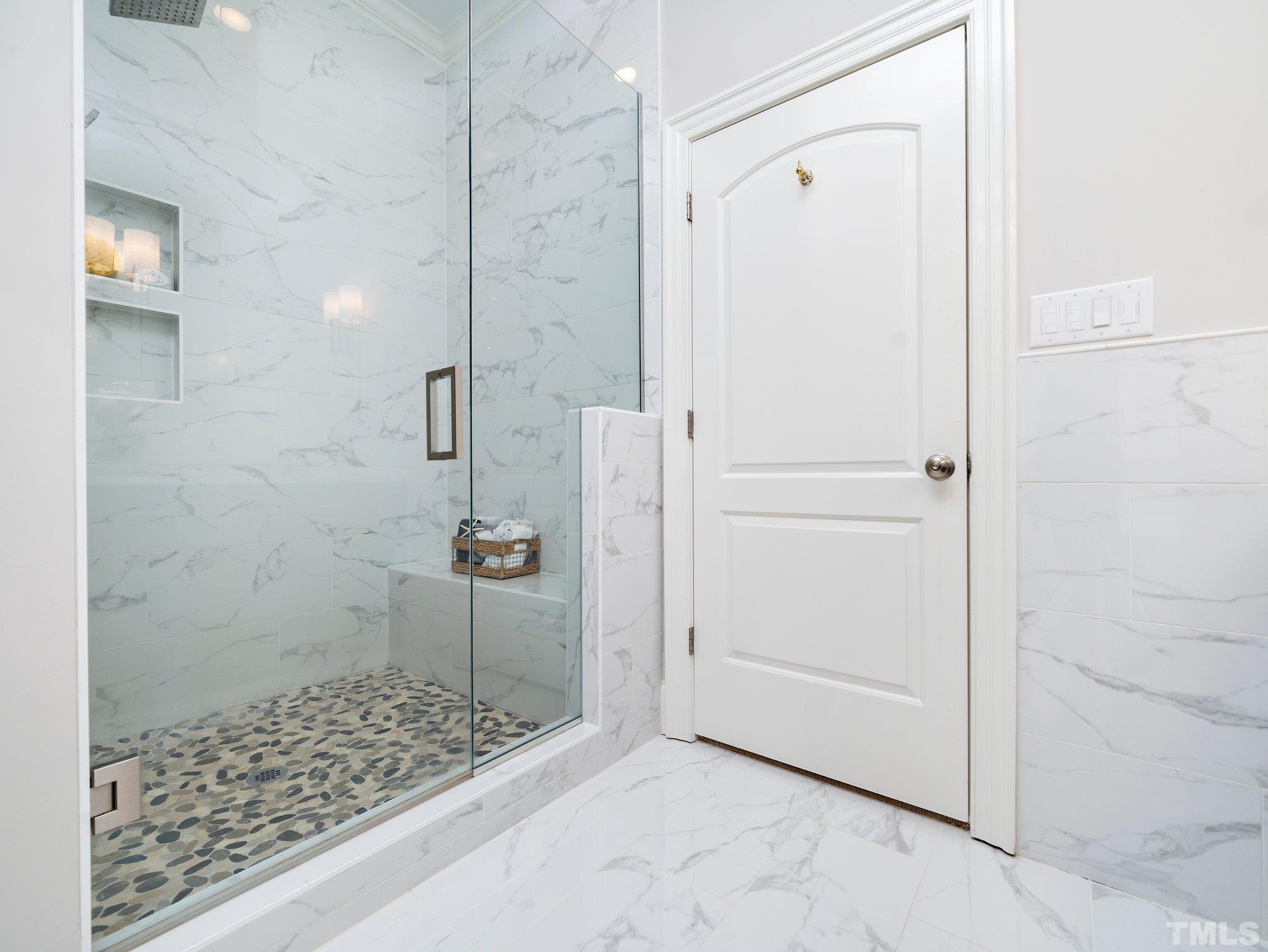 8104 Harps Mill Road Raleigh, NC 27615 - Photo 29 of 57 a bathroom with a shower and a sink