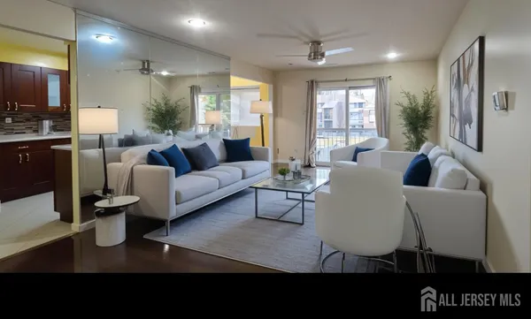 a living room with furniture potted plant and a window