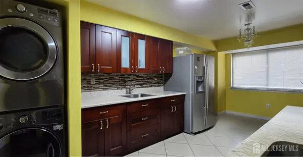 a view of a kitchen with washer and dryer