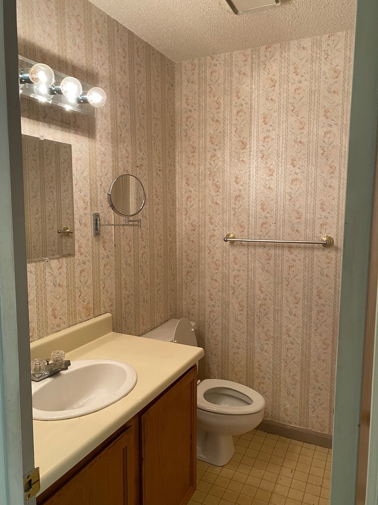 2047 Shields Road Dalton, GA 30720 - Photo 8 of 15 a bathroom with a granite countertop sink toilet and shower