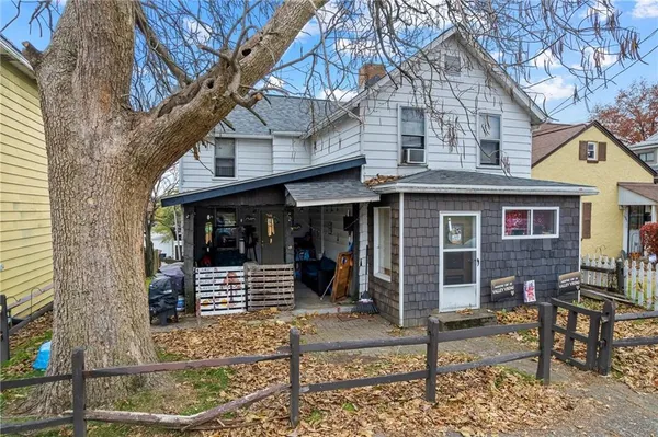 a front view of a house with glass windows