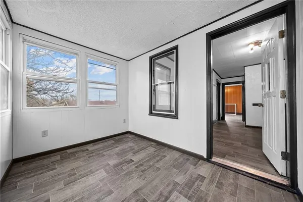 a view of an empty room with glass door
