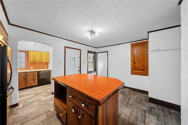 a room with pool table and window
