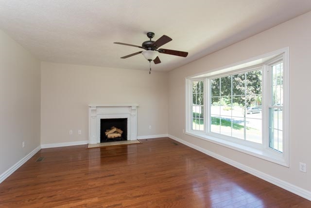 1228 Pinehurst Road Staunton, VA 24401 - Photo 9 of 24 Gas fireplace in living room with beautiful picture windows and hardwood floors
