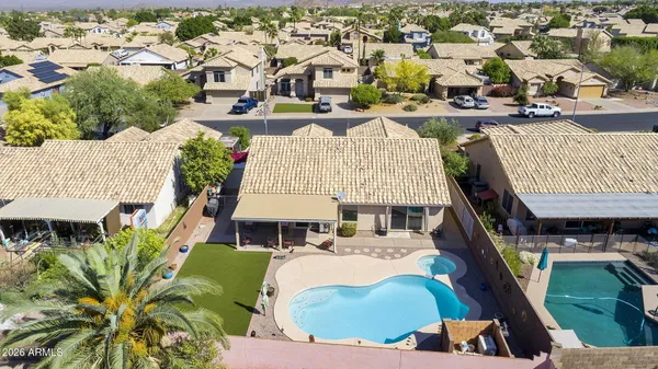 an aerial view of a house with outdoor space