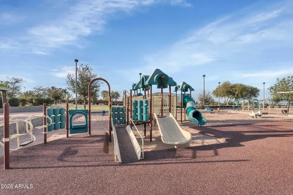 a view of a park with swings and slides
