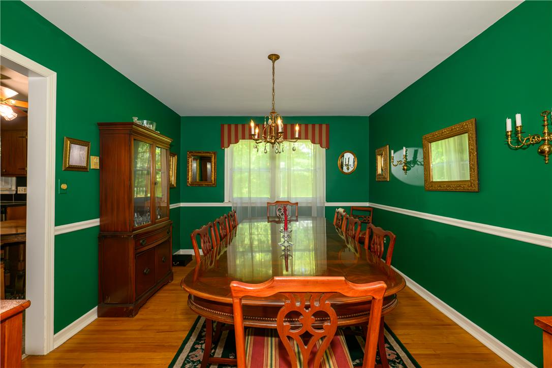 2516 Rachael Lane Orefield, PA 18069 - Photo 9 of 45 Hardwood floors and a grand chandelier define this formal dining space.