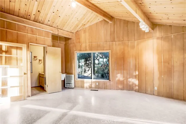 a view of a large room with a balcony and large window