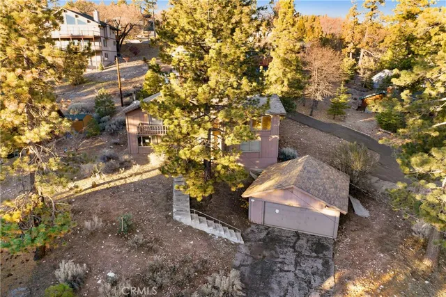 an aerial view of residential house with outdoor space and swimming pool