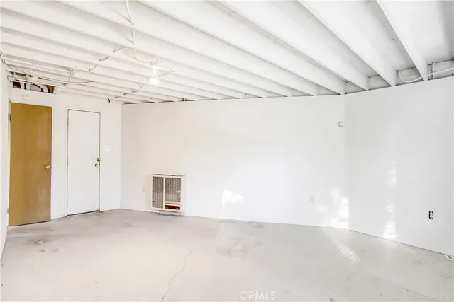 a view of a room with wooden walls