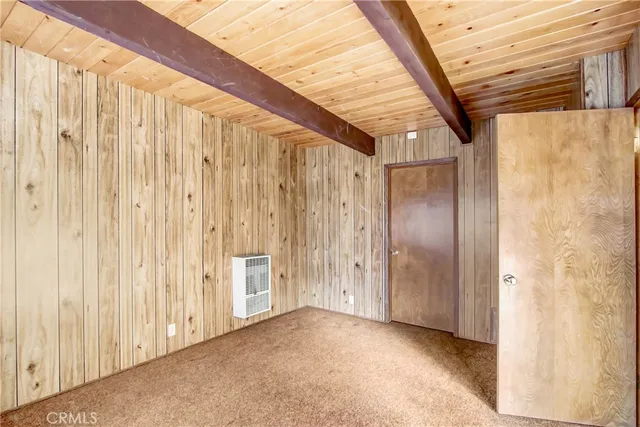 a view of a porch with wooden walls