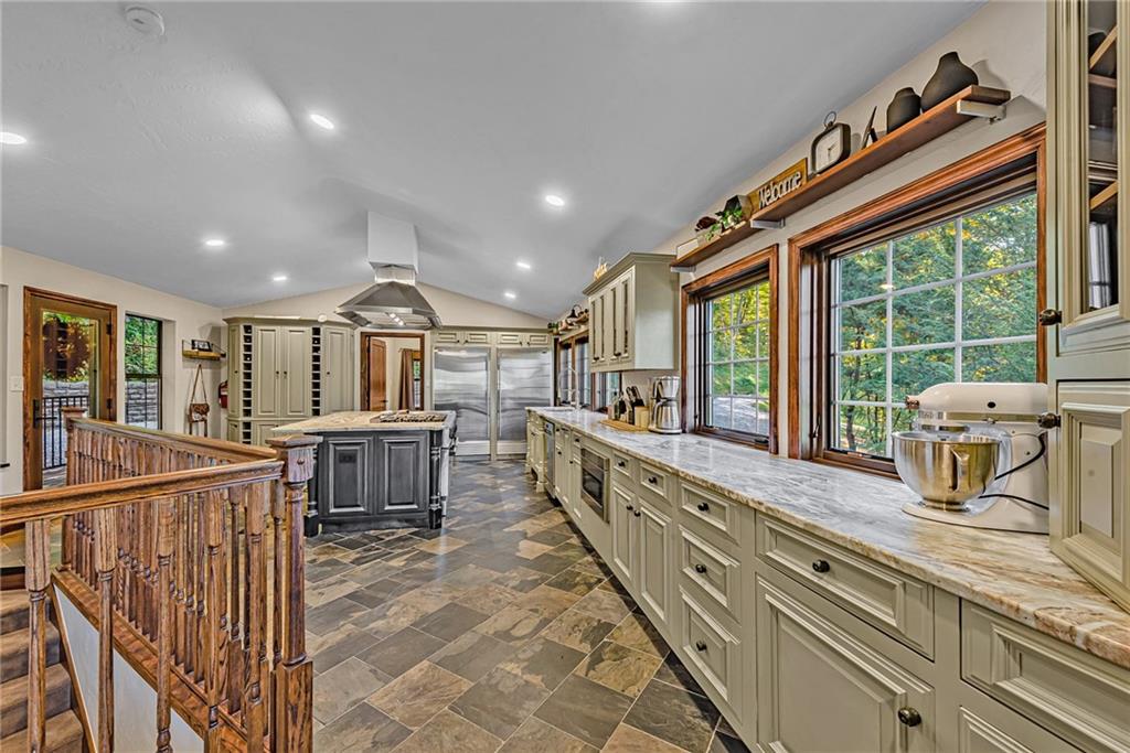 539 Lake Road Addison, PA 15411 - Photo 13 of 43 a open kitchen with kitchen island granite countertop a large window and a sink
