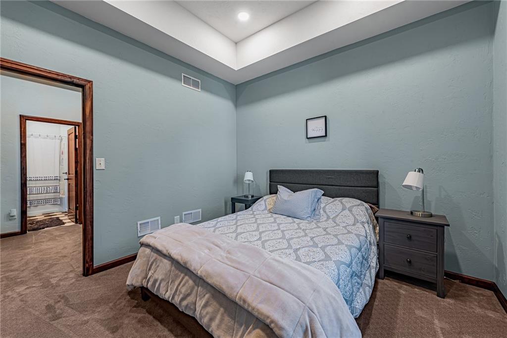 539 Lake Road Addison, PA 15411 - Photo 19 of 43 a bedroom with a bed and a lamp