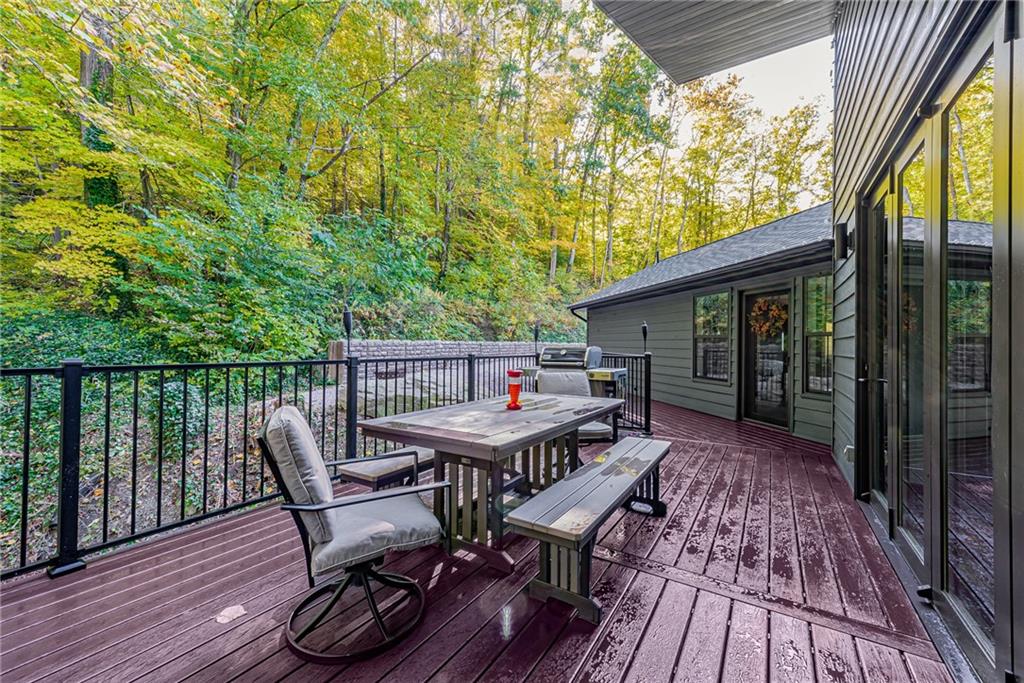 539 Lake Road Addison, PA 15411 - Photo 22 of 43 a roof deck with table and chairs and wooden floor