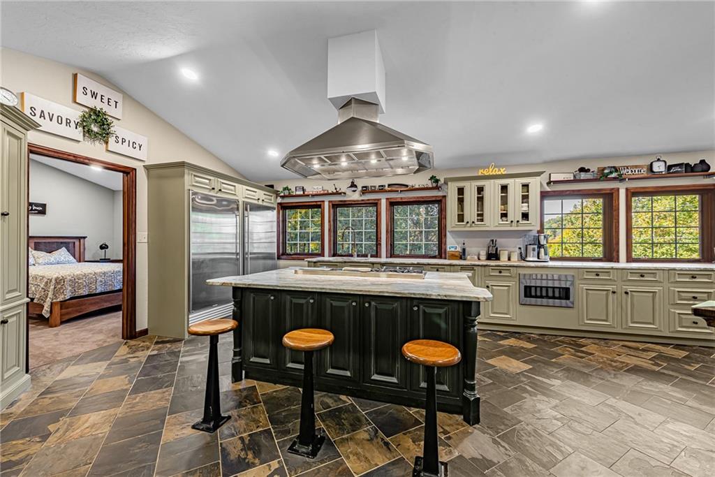 539 Lake Road Addison, PA 15411 - Photo 24 of 43 a kitchen with stainless steel appliances granite countertop a stove and more cabinets