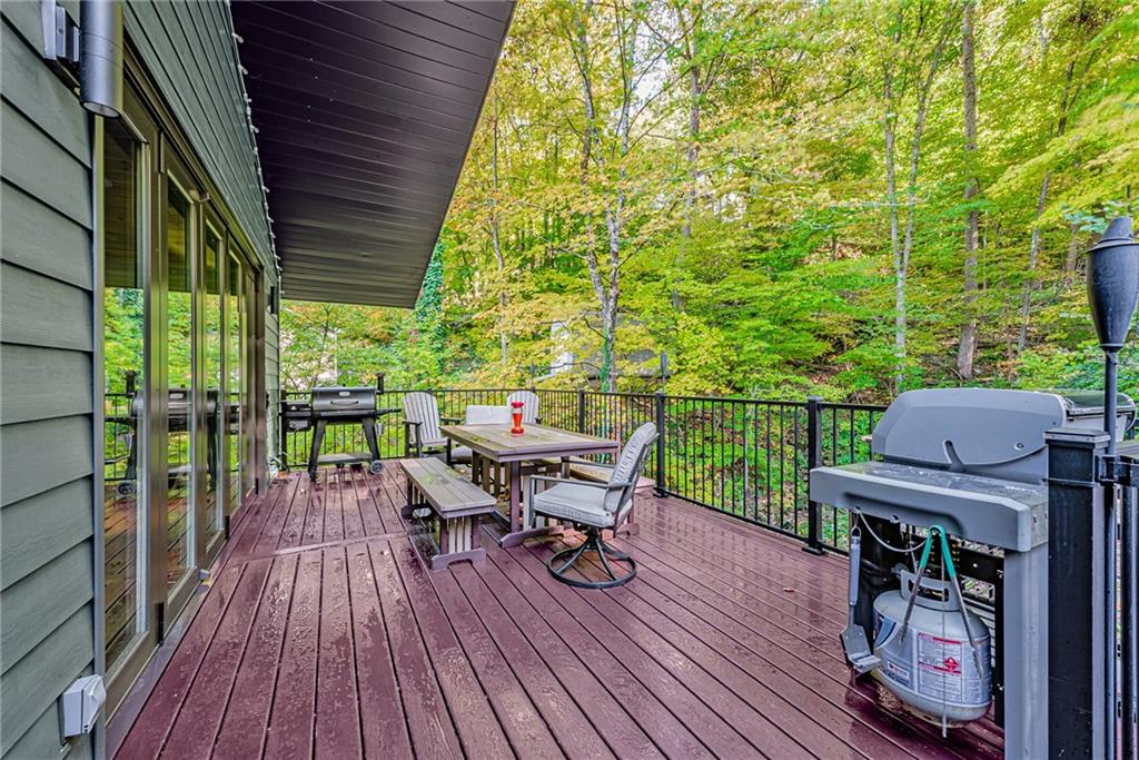 539 Lake Road Addison, PA 15411 - Photo 3 of 43 a view of a deck with chairs and wooden floor
