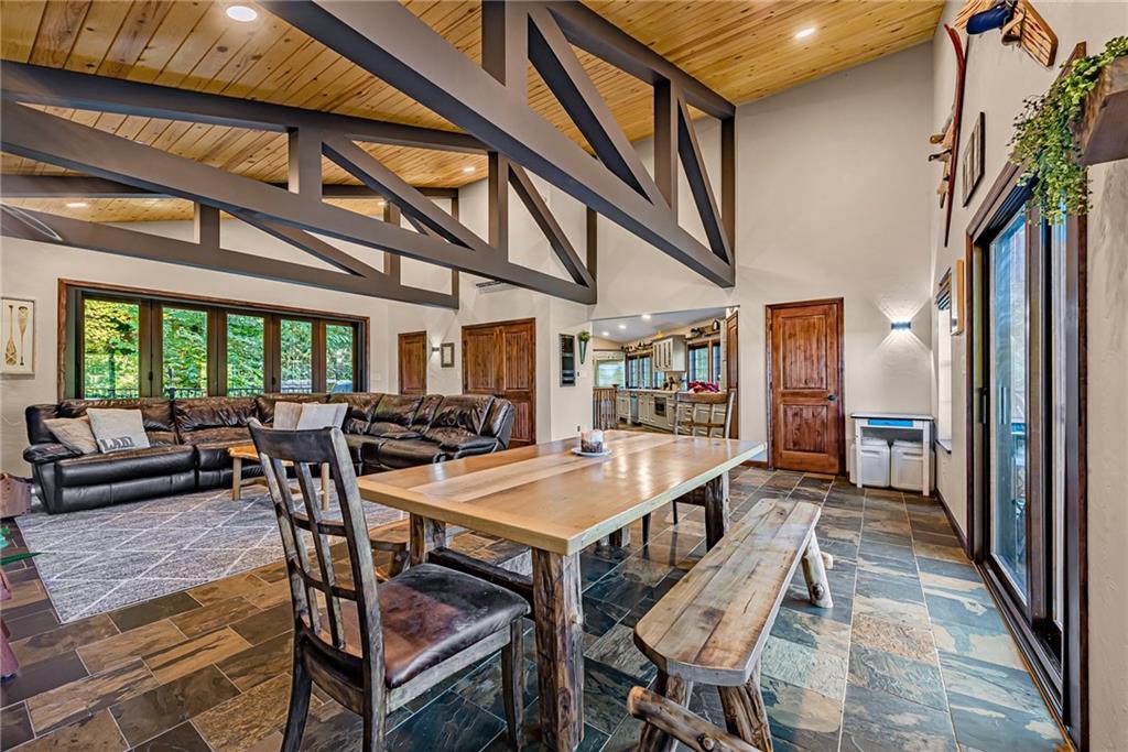 539 Lake Road Addison, PA 15411 - Photo 36 of 43 a dining room with furniture and a floor to ceiling window