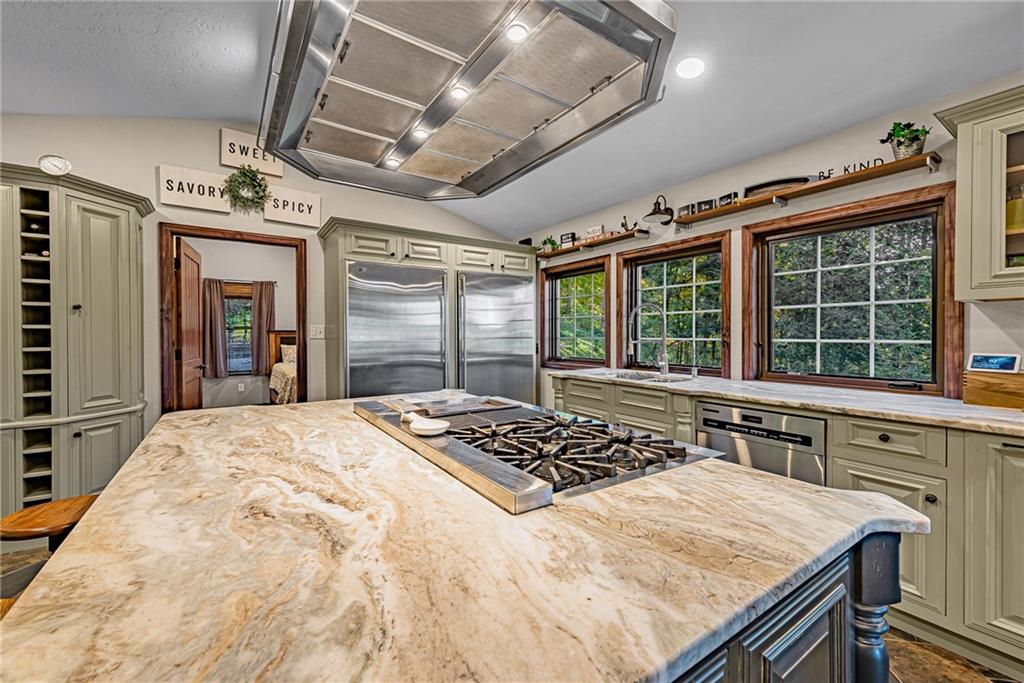 539 Lake Road Addison, PA 15411 - Photo 8 of 43 a kitchen with a stove a sink and a refrigerator