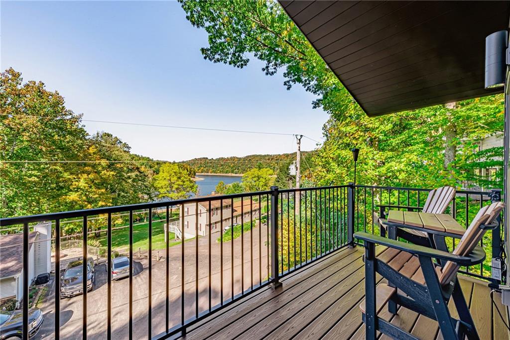 539 Lake Road Addison, PA 15411 - Photo 9 of 43 a view of a balcony with wooden floor and outdoor seating