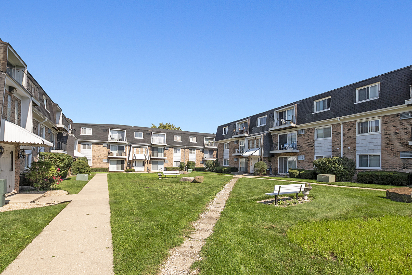 10320 Ridgeland Avenue, Unit 308 Chicago Ridge, IL 60415 - Photo 15 of 16 a front view of a building with a yard