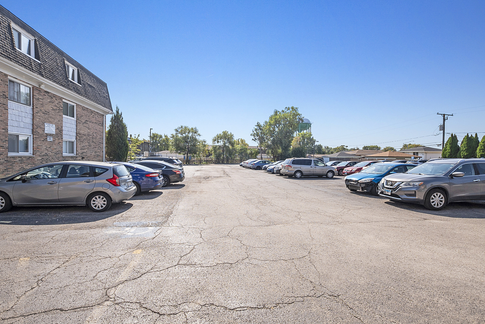 10320 Ridgeland Avenue, Unit 308 Chicago Ridge, IL 60415 - Photo 16 of 16 a view of cars parked on the side of a street