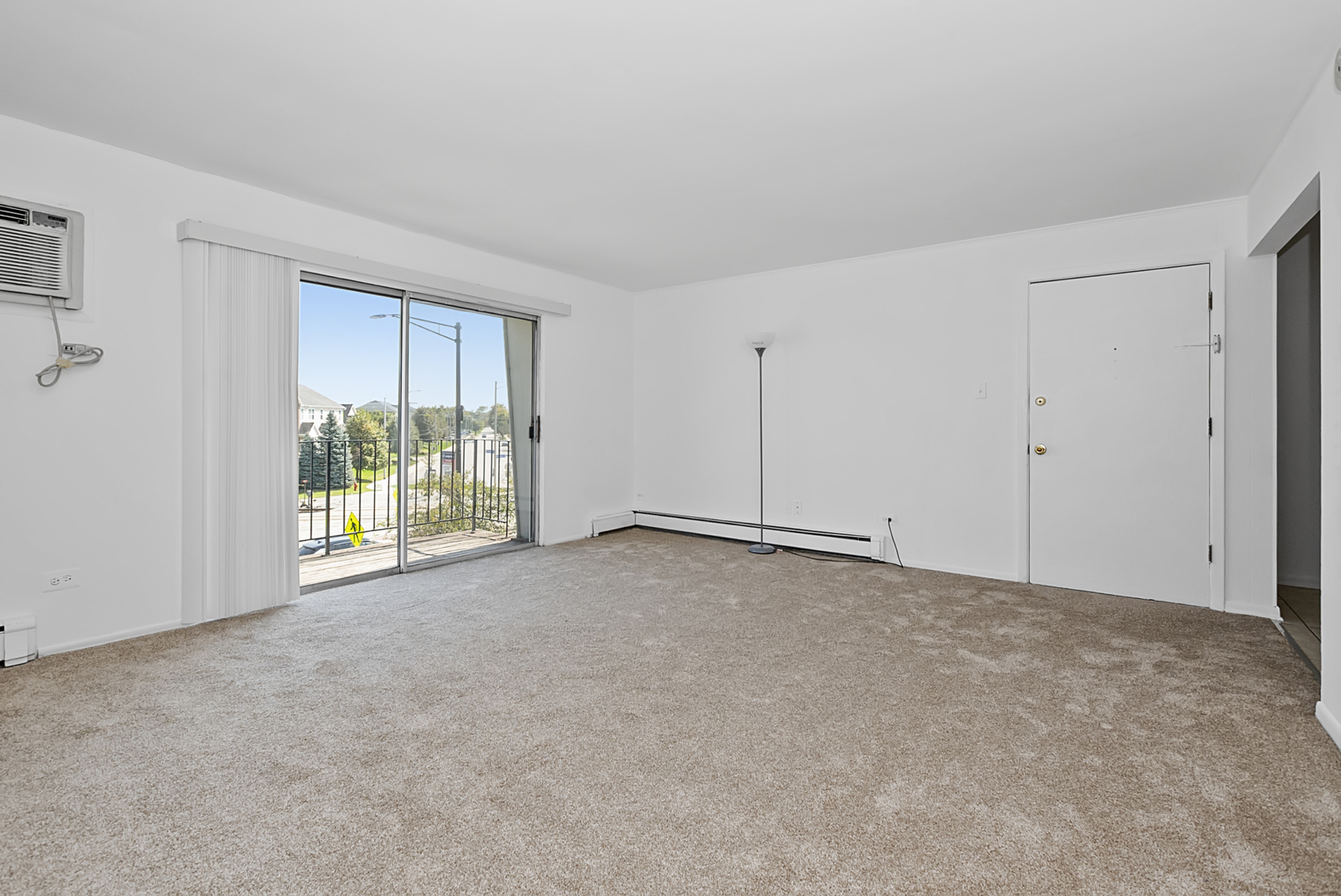 10320 Ridgeland Avenue, Unit 308 Chicago Ridge, IL 60415 - Photo 7 of 16 a view of an empty room with a window