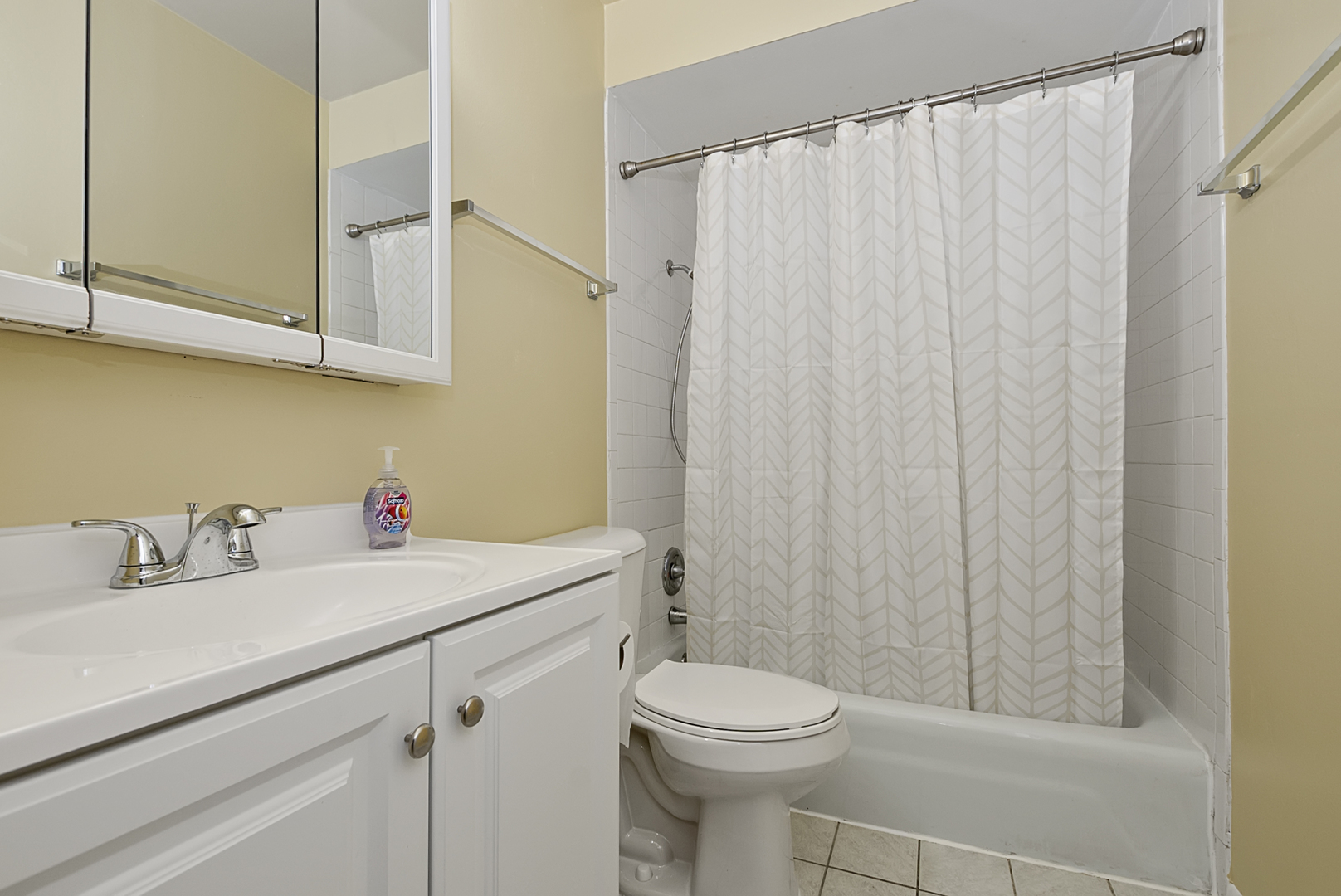 10320 Ridgeland Avenue, Unit 308 Chicago Ridge, IL 60415 - Photo 8 of 16 a bathroom with a sink a toilet and shower
