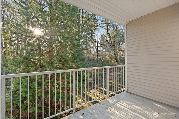 a view of balcony with wooden floor